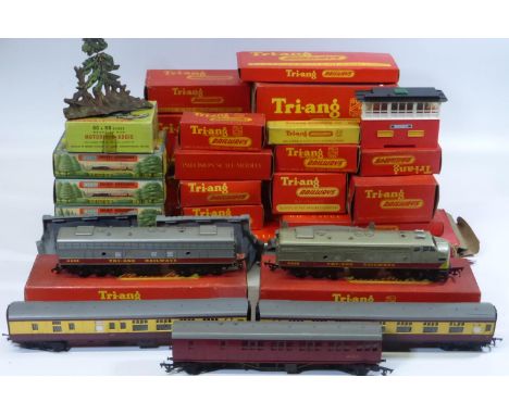 HORNBY 'OO' GAUGE RAILWAY. A box of 26 boxed components, track, carriages, buildings, platform parts, Diesel 4008 TC B-B, and