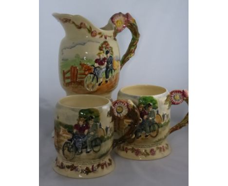 A 1930'S CROWN DEVON MUSICAL 'DAISY BELL' PITCHER and two matching tankards, the sides moulded with the scenes of Daisy and h