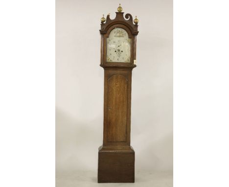 An oak longcase clock, the painted dial inscribed J. MANN NORWICH, with an eight day movement, striking on a bell