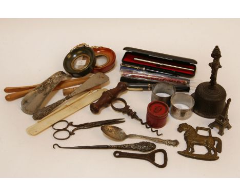 A box of collectors items to include a corkscrew, pair of small circular picture frames, a pair of silver handled button hook