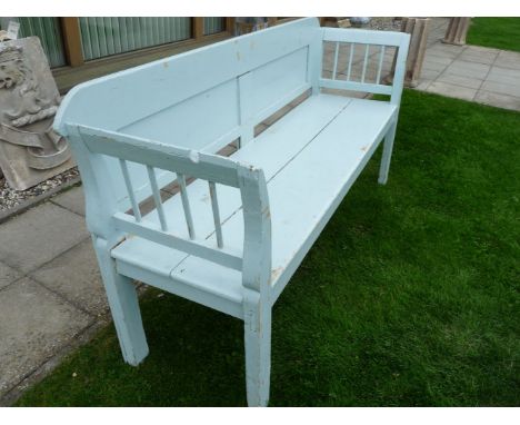 An early 20th century blue painted pine bench, the panel back above solid seat, on square section supports, 184cm wide, 90cm 