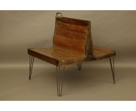 An early to mid 20th century double seat bench, originally taken from a Dutch tram, and stood on steel legs, 94 x 100 x 103cm