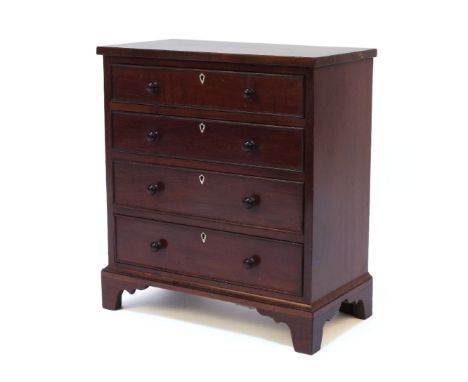 A miniature apprentice piece mahogany chest of drawers, on bracket feet, 25cm high