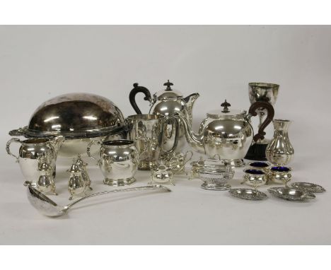 A large quantity of mixed silver plate, four piece tea service, cruet sets x 3, trophy cups, and a warming dish, with revolvi