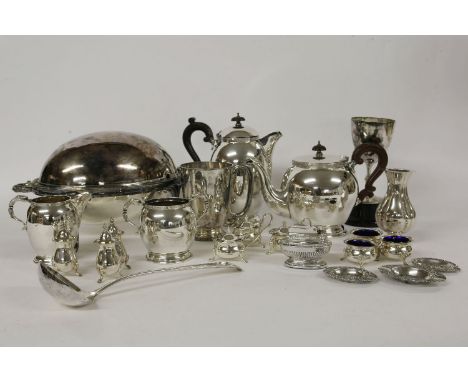 A large quantity of mixed silver plate, four piece tea service, cruet sets x 3, trophy cups, and a warming dish, with revolvi