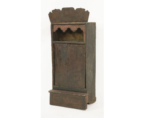 An Afghan shrine cabinet, probably 19th century, with a shaped crest over an open shelf and two doors with all-over painted d