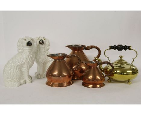A Victorian brass toddy kettle, with turned ebony handle, 21cm high, a graduated set of three copper measuring jugs, and a pa