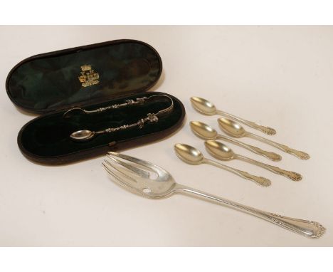 A set of five silver teaspoons, hallmarked, a cased pair of sugar tongs with cherub detail, and a silver serving spoon, appro