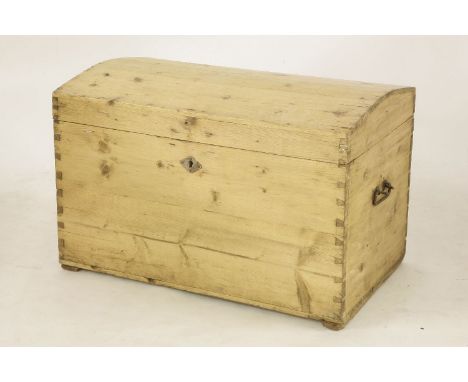 An early 20th century dome topped trunk, fitted pair of wrought iron carrying handles, 79cm wide, 47cm deep, 51cm high