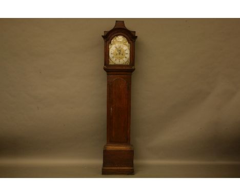 An 18th century eight day oak longcase clock, by William Peacock, Kimbelton, the brass arching dial with silvered chapter rin