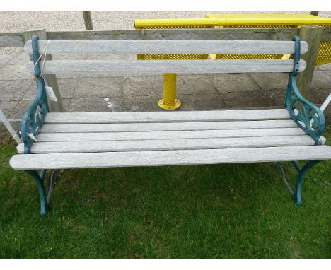 A garden bench, with iron ends and hardwood slats153cm wide