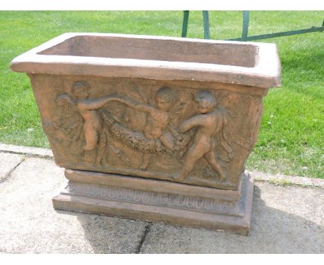 A terracotta planter on a stand