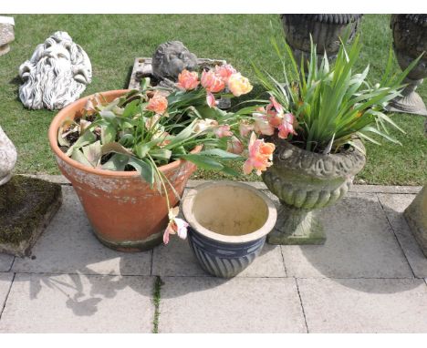 Three various garden planters, a low urn of campagna form, a terracotta planter, and one other (3)