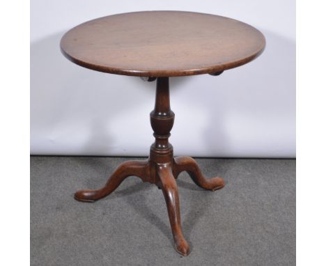 A George III mahogany pedestal table, circular tilt top, baluster column, tripod legs, diameter 64cm, height 61cm.