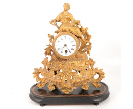 Late 19th Century French gilt spelter mantel clock, enamelled dial, cylinder movement, on an oval plinth, 38cm.