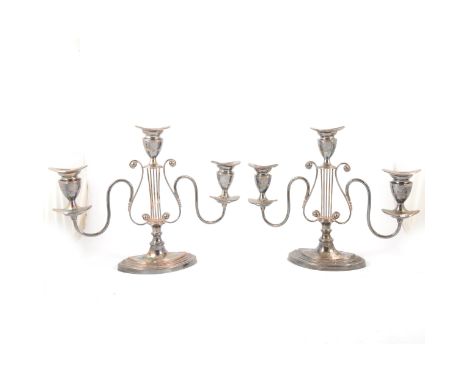 Pair of Regency style silver plated three-light candelabra, lyre centres with scrolled brackets, height 30cm.