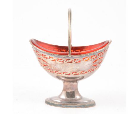 George III style electroplated pedestal sugar basket, swing handle, pierced and 'engraved' decoration, with ruby glass liner,