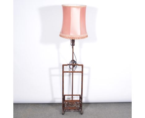 A Chinese carved hardwood standard lamp, adjustable slide mechanism, pink satin shade, minimum height 140cm including fitting