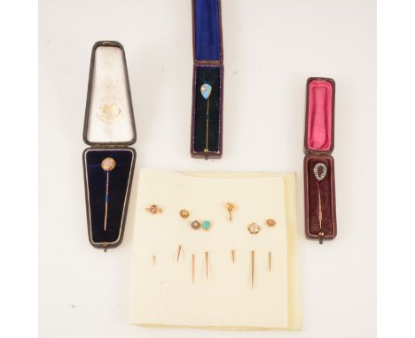 Three stick pins in boxes and seven other small pins, a turquoise egg shaped pin star set with a pearl, a garnet coloured pin