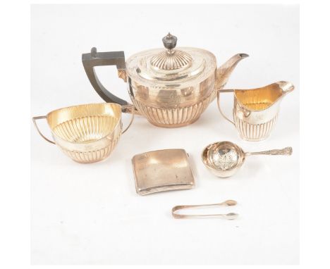 A silver three-piece teaset, Goldsmiths &amp; Silversmiths Co Ltd, London 1908, comprising teapot (17cm), twin-handled sugar 