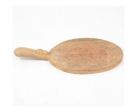 Robert "Mouseman" Thompson of Kilburn, a cheeseboard, oval form with signature mouse carved to the handle, length 38cm, width