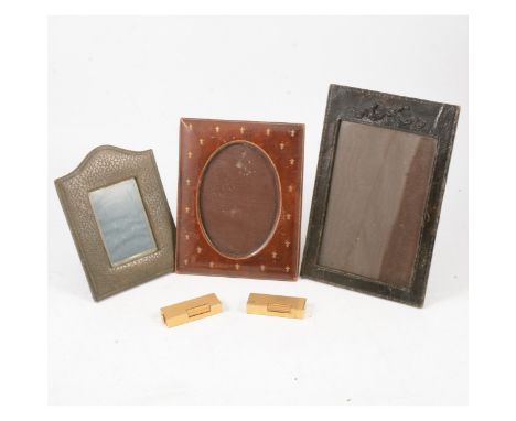 Two Dunhill Swiss gold-plated cigarette lighters, one bark textured, the other barley engine turned, both 6.5cm x 2.5cm; a br