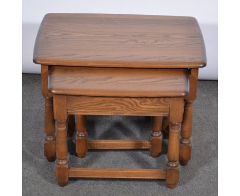 Nest of three modern Ercol tables, the largest rectangular, 62cmx46cm, the smallest near square, 38x37cm.