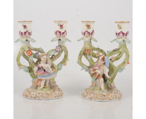 Pair of small Dresden 'Augusts Rex' two-light candelabra, modelled with children, each with painted and encrusted decoration,