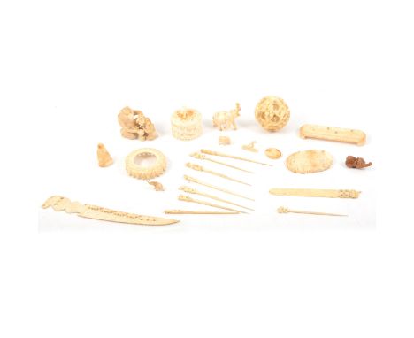 Quantity of carved ivory and bone ornaments including a Japanese netsuke of a baboon with young eating fruit, 5cm, a Chinese 