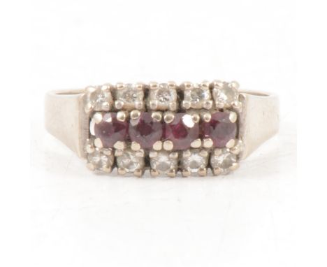 A ruby and diamond ring, four rubies and ten brilliant cut diamonds claw set into three horizontal rows in an 18 carat white 