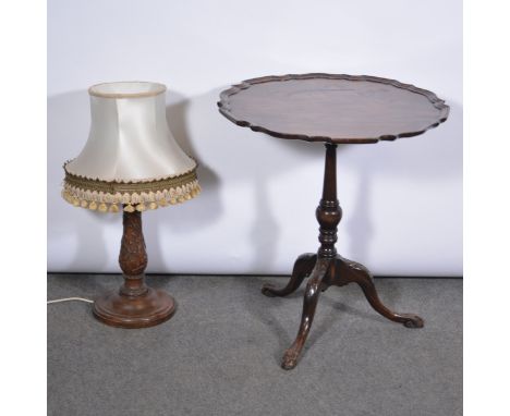 A reproduction stained mahogany pedestal table, circular top with a piecrust edge, turned column, tripod legs, diameter 61cm;