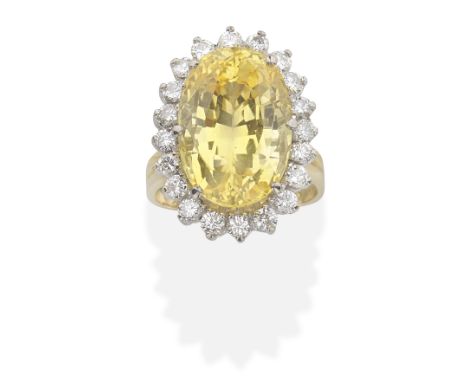 YELLOW SAPPHIRE AND DIAMOND RINGOval-cut yellow sapphire and brilliant-cut diamonds,  sapphire approx. 15.00cts, diamonds app