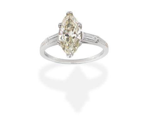 TIFFANY: FANCY COLOURED DIAMOND AND DIAMOND RINGMarquise-cut Fancy Yellow diamond, weighing 1.65 carats, between baguette-cut