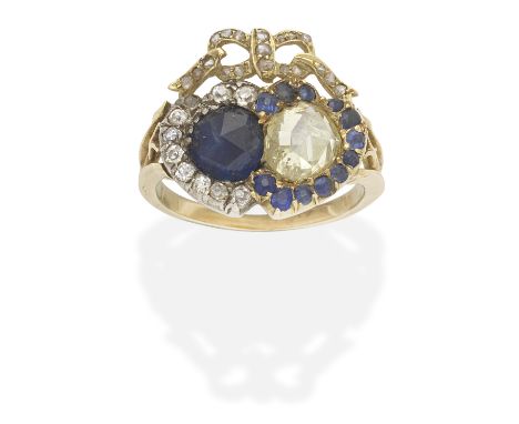 SAPPHIRE AND DIAMOND TWIN HEART RING, CIRCA 1890The rose-cut sapphire and diamond of yellow tint, within a circular-cut sapph
