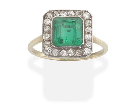 EMERALD AND DIAMOND RINGStep-cut emerald within a cushion-shaped diamond surround,  emerald approx. 1.55cts, ring size approx