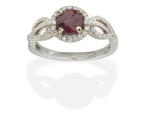 RUBY AND DIAMOND RINGCircular-cut ruby and brilliant-cut diamonds, mounted in 18 carat white gold, London hallmark, ring size