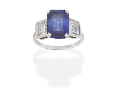 SAPPHIRE AND DIAMOND RINGEmerald-cut sapphire, between square step-cut diamond shoulders,  sapphire approximately 4.30 carats