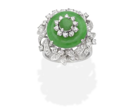 JADE AND DIAMOND CLUSTER RINGJade hololith and jade circular cabochon, with brilliant-cut diamonds, diamonds approx. 0.40ct t
