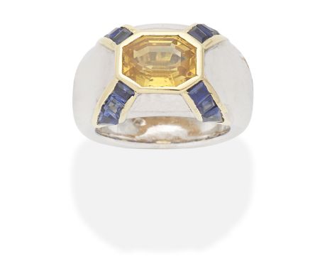 YELLOW SAPPHIRE AND SAPPHIRE RINGStep-cut yellow sapphire and calibré-cut sapphires, yellow sapphire approx. 2.85cts, ring si