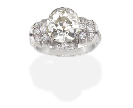 DIAMOND CLUSTER RINGThe central old brilliant-cut diamond, weighing 3.92 carats, with single-cut diamond accents,  ring size 