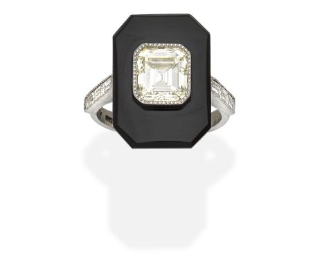 ONYX AND DIAMOND PLAQUE RINGThe emerald-cut diamond within an onyx surround, between baguette-cut diamond shoulders, principa