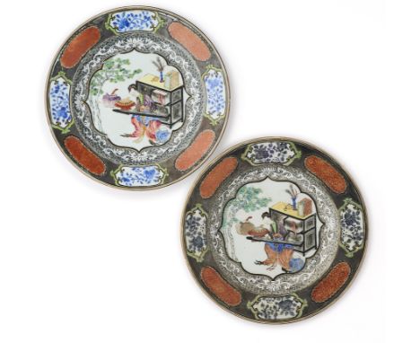 each brightly famille-rose enamelled to the interior with a quatrefoil panel enclosing a seated lady playing a qin, encircled