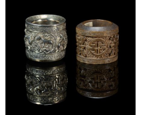 comprising: a silver ring, decorated with a wide central band enclosing the 'Eight Horses of Mu Wang' between narrower floral