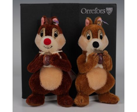 These two adorable chipmunks, crafted from genuine mohair, feature light chestnut brown and russet coloring. Both are holding