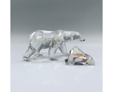 A 2011 annual edition of an Artic bear in moonlight colored crystal with black crystal eyes and nose. Includes an iceberg for