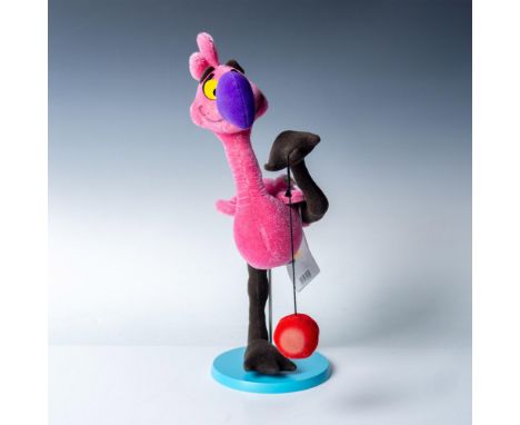 Mohair and fabric figure of the smiling pink Yo Yo Flamingo standing with one leg raised holding a yo-yo. Celebrating the 60t