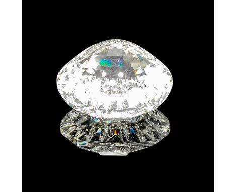 Clear crystal shell catches the light with facets throughout shell. Swarovski backstamp. 9100 000 024. This item has its orig