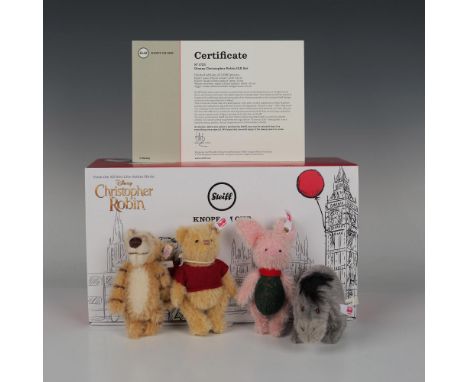 This collectible Steiff plush toy gift set features Winnie the Pooh, complete with his iconic red shirt and yellow fur. Refle