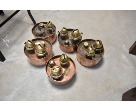 Five vintage copper and brass poultry heaters