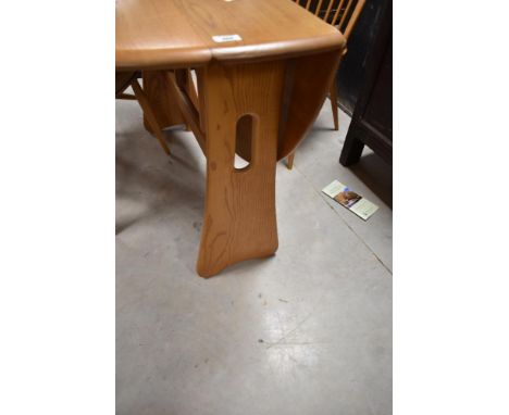 An Ercol Windsor drop leaf dining table